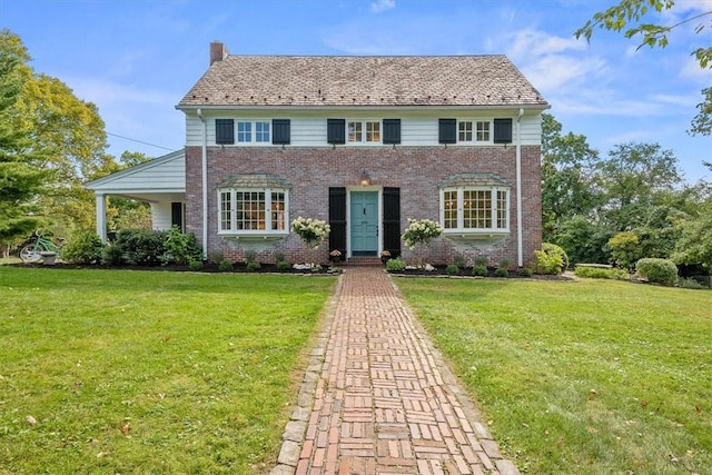 209 Eton Rd, Thornburg, PA 15205 - colonial inspired home featuring a front lawn, brick siding, and a chimney