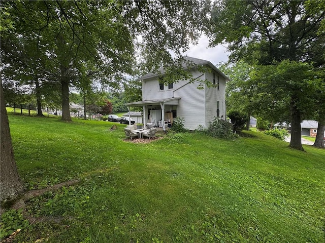 311 1st Ave, Belle Vernon Fay, PA 15012 - rear view of house with a lawn