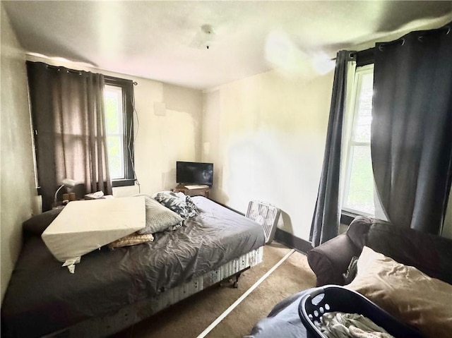 311 1st Ave, Belle Vernon Fay, PA 15012 - carpeted bedroom featuring multiple windows and baseboards