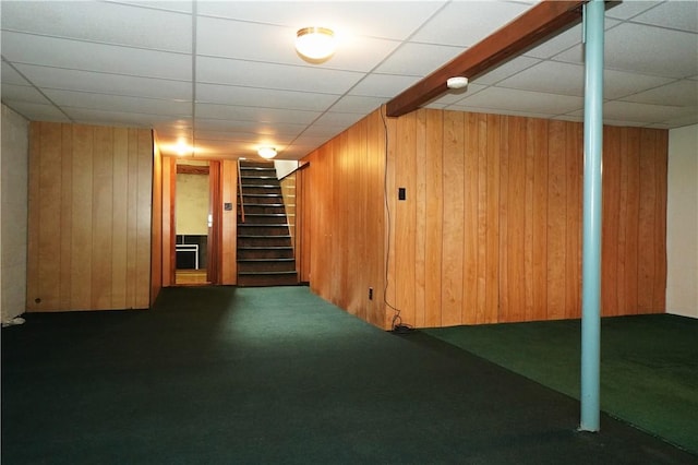 7 Windridge Dr, Uniontown, PA 15401 - finished basement featuring carpet flooring, wood walls, stairway, built in shelves, and a drop ceiling