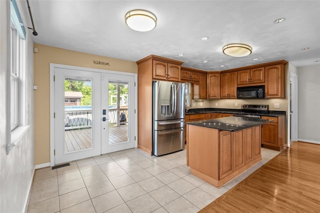 3315 Crestview Dr N, Versailles, PA 15137 - kitchen featuring stainless steel appliances, baseboards, french doors, brown cabinetry, and recessed lighting