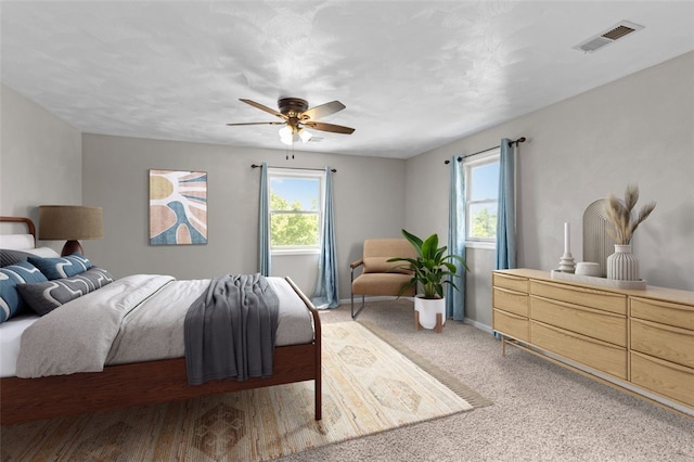 3315 Crestview Dr N, Versailles, PA 15137 - bedroom featuring multiple windows, baseboards, a ceiling fan, and light colored carpet