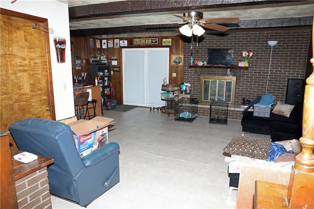 5 Moyer Ave, Scottdale, PA 15683 - living area featuring beam ceiling, a ceiling fan, a fireplace, and tile patterned floors