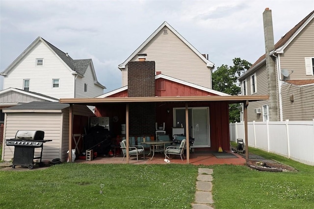 5 Moyer Ave, Scottdale, PA 15683 - rear view of property featuring board and batten siding and a patio area