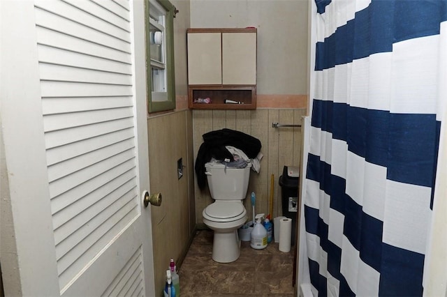 5 Moyer Ave, Scottdale, PA 15683 - full bath featuring toilet, tile walls, and wainscoting