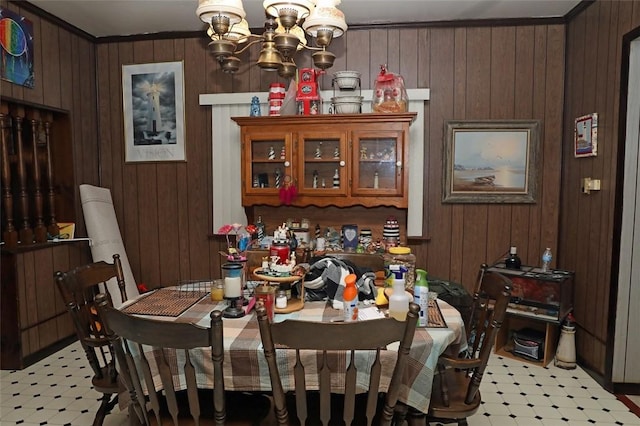 5 Moyer Ave, Scottdale, PA 15683 - dining space with light flooring, a chandelier, wooden walls, and crown molding