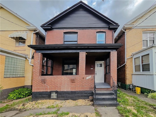 1105 Stieren Ave, Brackenridge, PA 15014 - american foursquare style home featuring brick siding and covered porch
