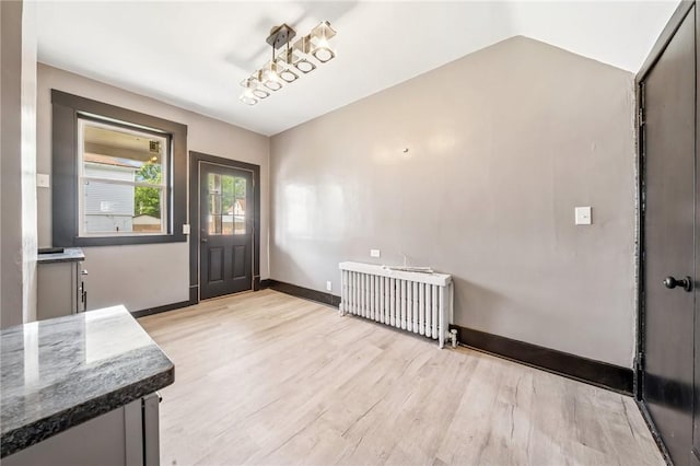 1105 Stieren Ave, Brackenridge, PA 15014 - entryway featuring radiator heating unit, light wood finished floors, and baseboards