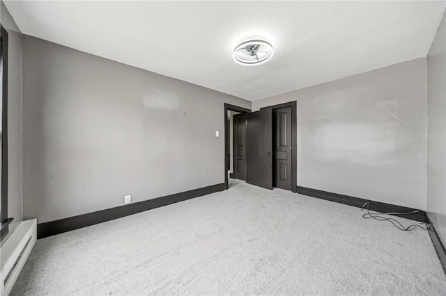 1105 Stieren Ave, Brackenridge, PA 15014 - unfurnished bedroom with carpet flooring, a baseboard radiator, and baseboards