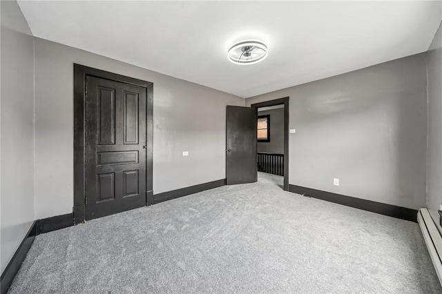 1105 Stieren Ave, Brackenridge, PA 15014 - unfurnished bedroom featuring baseboard heating, carpet flooring, and baseboards