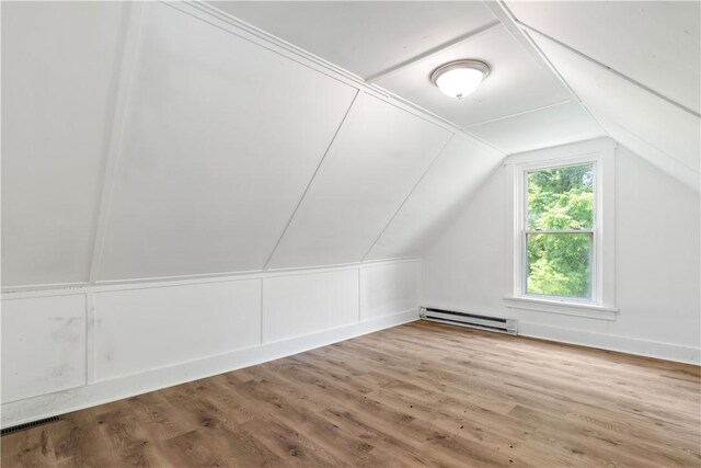 1567 Princeton Blvd, Wilkinsburg, PA 15221 - bonus room with a baseboard heating unit, lofted ceiling, and wood finished floors