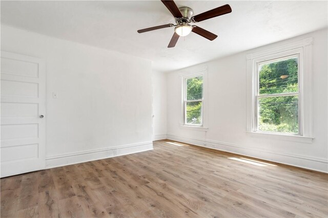 1567 Princeton Blvd, Wilkinsburg, PA 15221 - empty room featuring wood finished floors, a ceiling fan, and baseboards