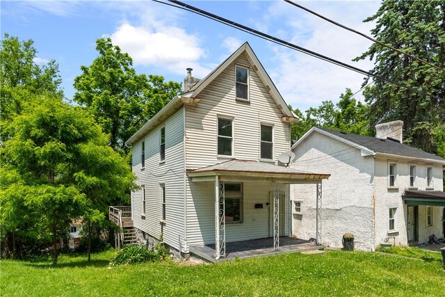 1567 Princeton Blvd, Wilkinsburg, PA 15221 - view of front facade with a front lawn