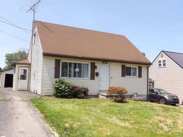 2042 Madison St, Hermitage, PA 16148 - cape cod house featuring a front lawn and a shingled roof