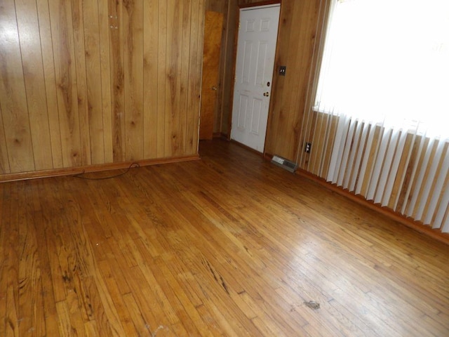 2042 Madison St, Hermitage, PA 16148 - unfurnished room featuring hardwood / wood-style flooring and wooden walls