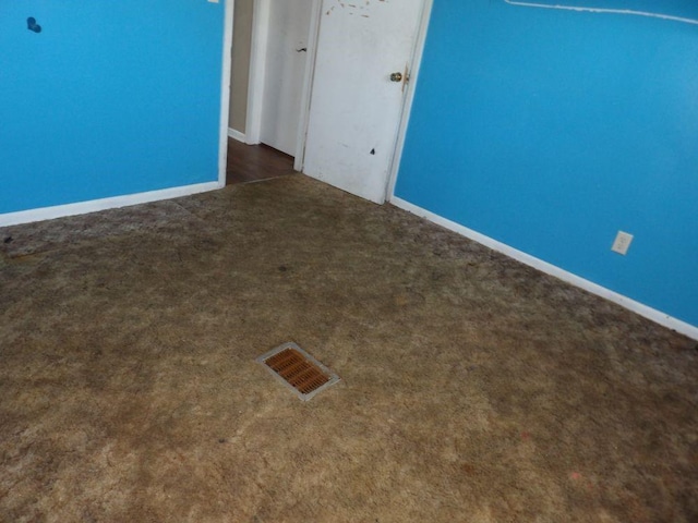2042 Madison St, Hermitage, PA 16148 - empty room featuring dark colored carpet and baseboards