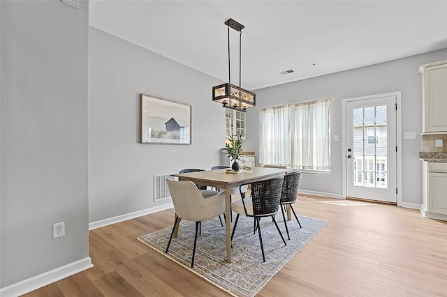 1009 Grey Fox Cir, Scott Twp Sal, PA 15017 - dining room featuring a chandelier, light wood-type flooring, and baseboards