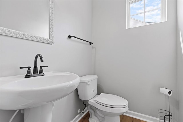 1009 Grey Fox Cir, Scott Twp Sal, PA 15017 - bathroom with toilet, wood finished floors, a sink, and baseboards