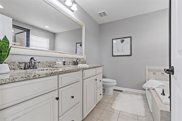 1009 Grey Fox Cir, Scott Twp Sal, PA 15017 - bathroom featuring double vanity, toilet, a garden tub, tile patterned floors, and baseboards