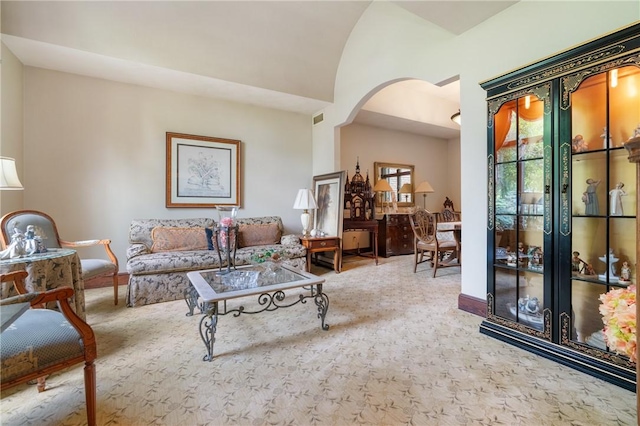 26 Indian Fields Trl, Lower Burrell, PA 15068 - living area with arched walkways, vaulted ceiling, and baseboards