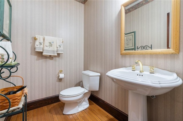 26 Indian Fields Trl, Lower Burrell, PA 15068 - half bath featuring hardwood / wood-style floors, wallpapered walls, and toilet