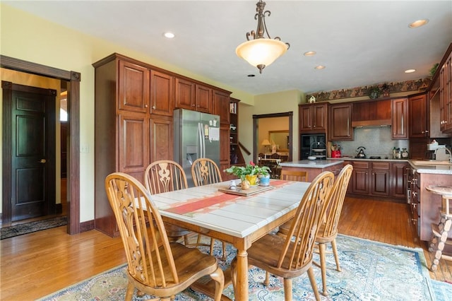 26 Indian Fields Trl, Lower Burrell, PA 15068 - dining room with light wood-type flooring, recessed lighting, and baseboards