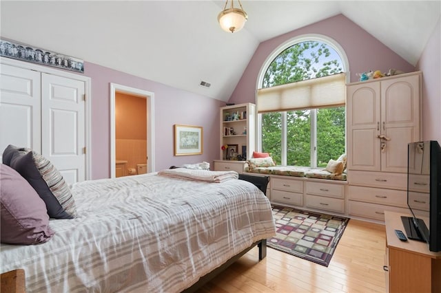26 Indian Fields Trl, Lower Burrell, PA 15068 - bedroom with vaulted ceiling, light wood-style flooring, and ensuite bath
