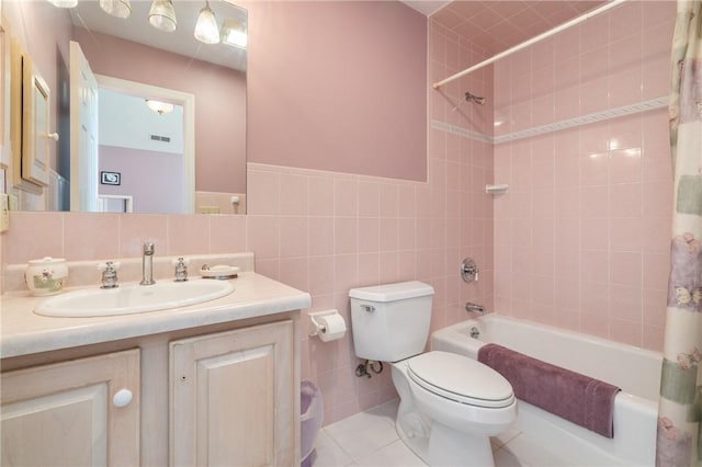 26 Indian Fields Trl, Lower Burrell, PA 15068 - bathroom featuring shower / tub combo, vanity, toilet, tile walls, and tile patterned floors