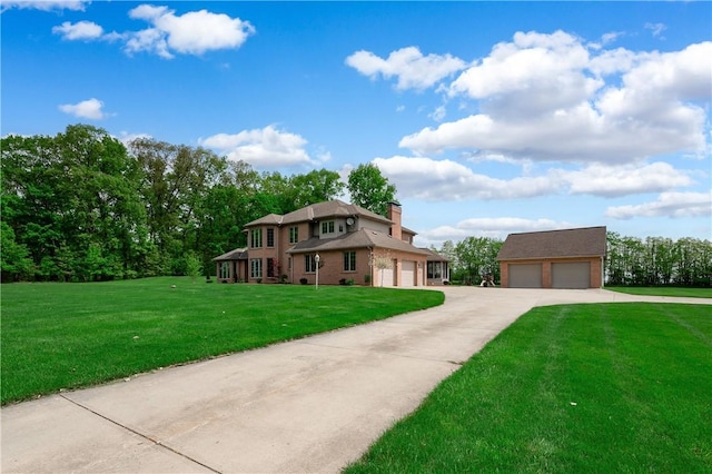 258 Smith Rd, Connoquenessing Twp, PA 16053 - view of front of house with a front lawn, a chimney, and a detached garage