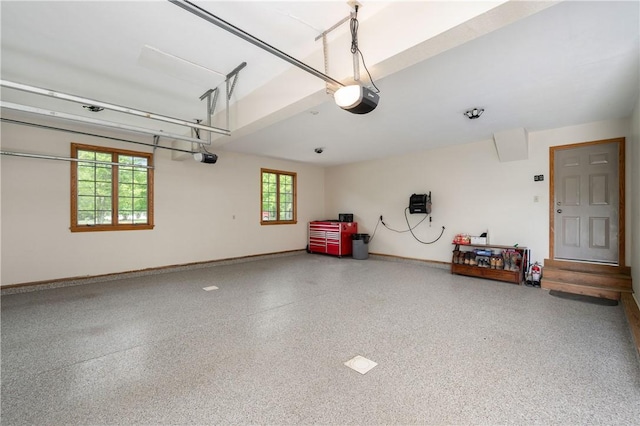 258 Smith Rd, Connoquenessing Twp, PA 16053 - garage with a garage door opener and baseboards