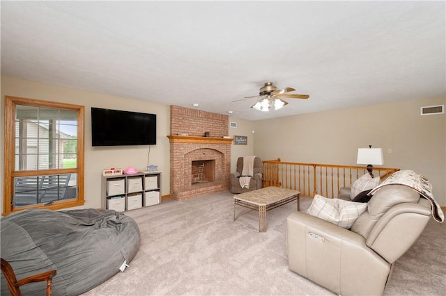 258 Smith Rd, Connoquenessing Twp, PA 16053 - living room with light carpet, ceiling fan, and a fireplace