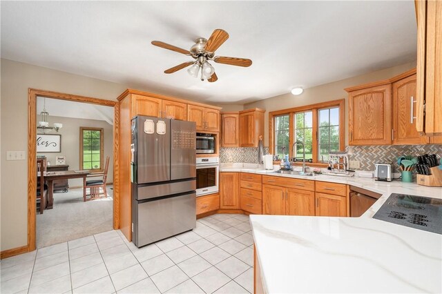258 Smith Rd, Connoquenessing Twp, PA 16053 - kitchen featuring stainless steel appliances, a sink, light countertops, and healthy amount of natural light