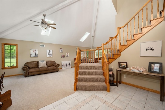 258 Smith Rd, Connoquenessing Twp, PA 16053 - stairs featuring high vaulted ceiling, ceiling fan, a skylight, tile patterned floors, and baseboards