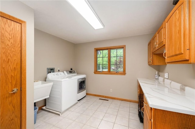 258 Smith Rd, Connoquenessing Twp, PA 16053 - laundry room with washing machine and dryer, cabinet space, and baseboards