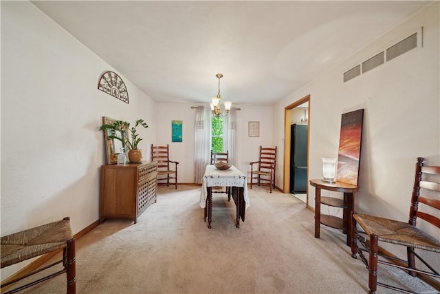 431 Darrell Dr, Penn Hills, PA 15235 - dining area with a chandelier, light colored carpet, and baseboards
