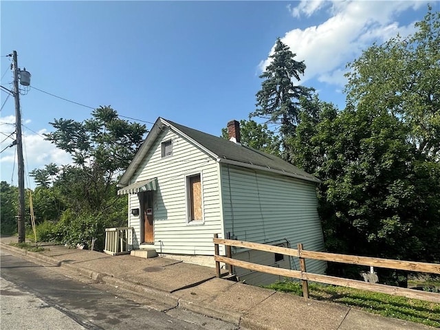 228 Walnut St, Donora, PA 15033 - view of side of home with a chimney