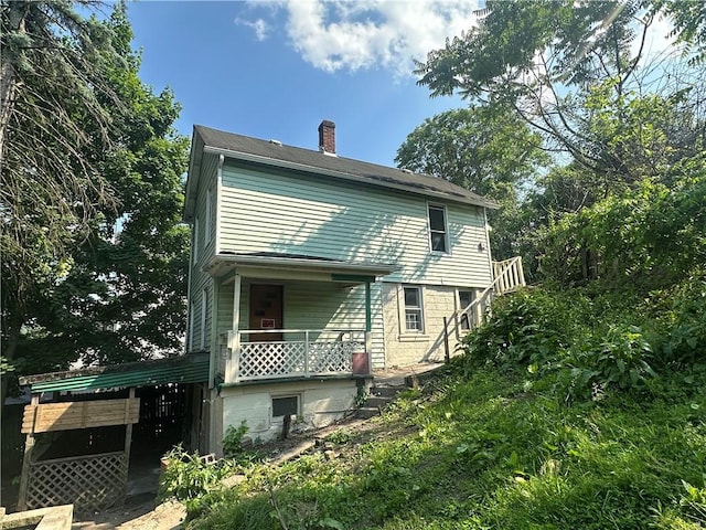 228 Walnut St, Donora, PA 15033 - back of property featuring a chimney and covered porch