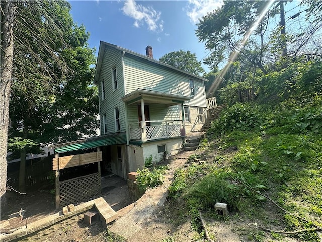 228 Walnut St, Donora, PA 15033 - view of side of property with a chimney and stairs