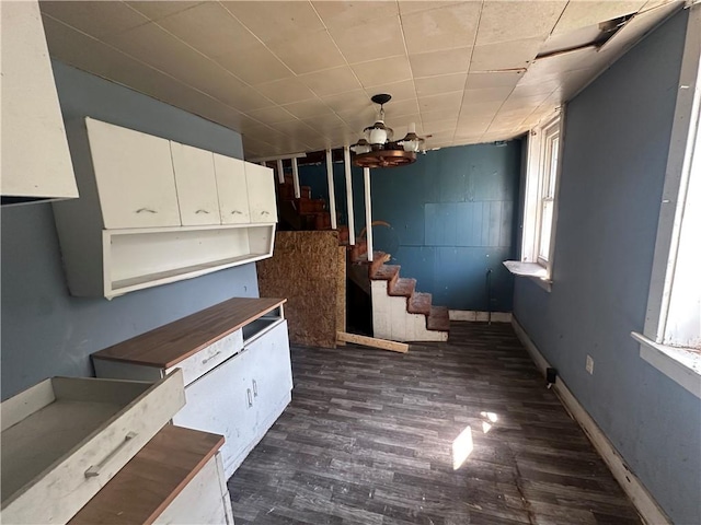 228 Walnut St, Donora, PA 15033 - kitchen featuring white cabinets, dark wood-type flooring, and pendant lighting