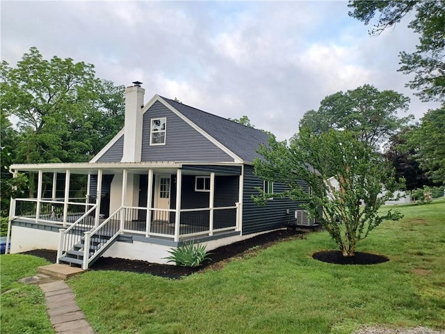 30 Evans Rd, Fallowfield, PA 15022 - rear view of house featuring a porch, a yard, a chimney, and roof with shingles