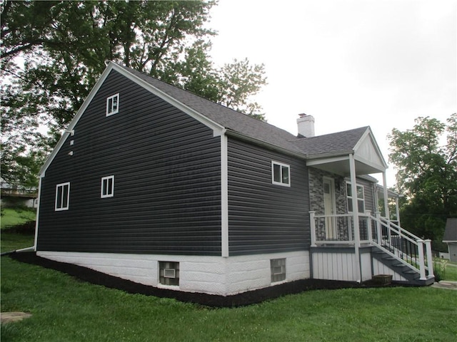 30 Evans Rd, Fallowfield, PA 15022 - view of home's exterior with a chimney, a lawn, and roof with shingles