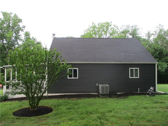30 Evans Rd, Fallowfield, PA 15022 - view of property exterior featuring central AC unit, a lawn, a shingled roof, and a chimney