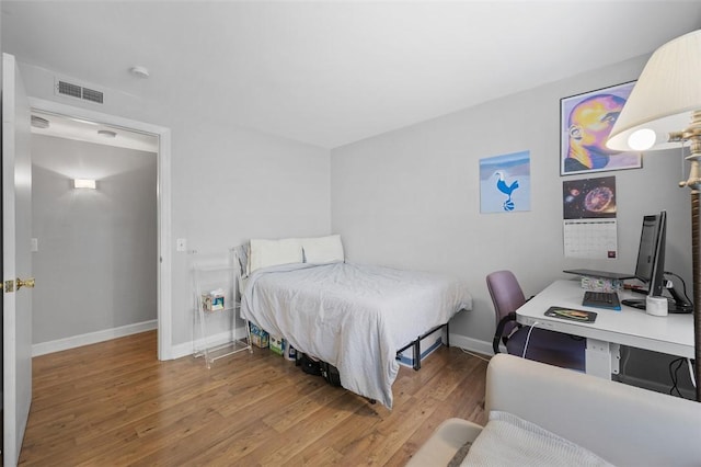 3266 Ward St Unit 8, Oakland, PA 15213 - bedroom with wood finished floors, baseboards, and a desk