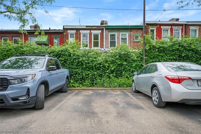 3266 Ward St Unit 8, Oakland, PA 15213 - view of front facade with uncovered parking, a chimney, and brick siding