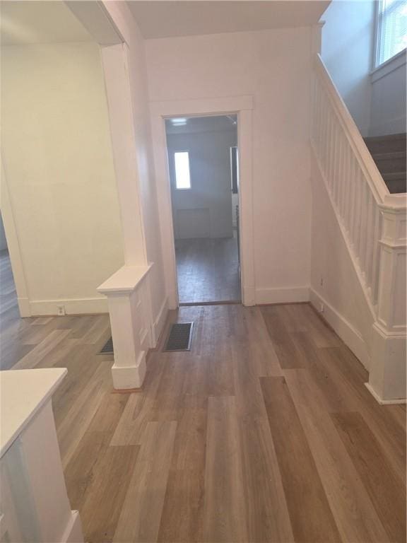 518 Waddell Ave, Clairton, PA 15025 - hallway featuring wood finished floors, stairway, baseboards, and plenty of natural light