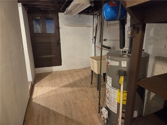 518 Waddell Ave, Clairton, PA 15025 - unfinished below grade area featuring gas water heater and wood finished floors