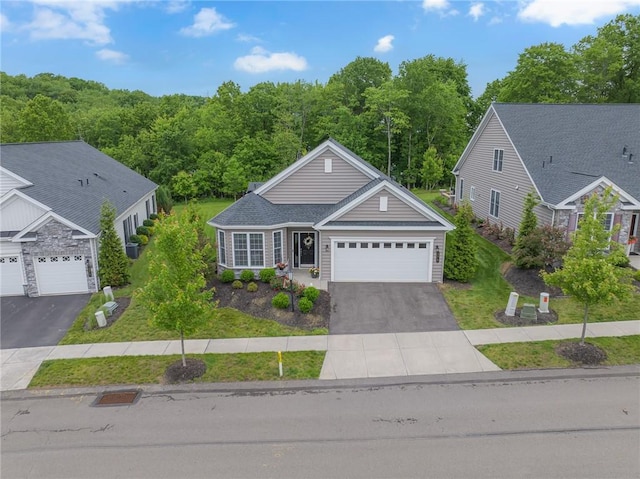 273 Jefferson Ln, Cranberry Twp, PA 16066 - view of front of property featuring asphalt driveway, an attached garage, a front lawn, and a forest view