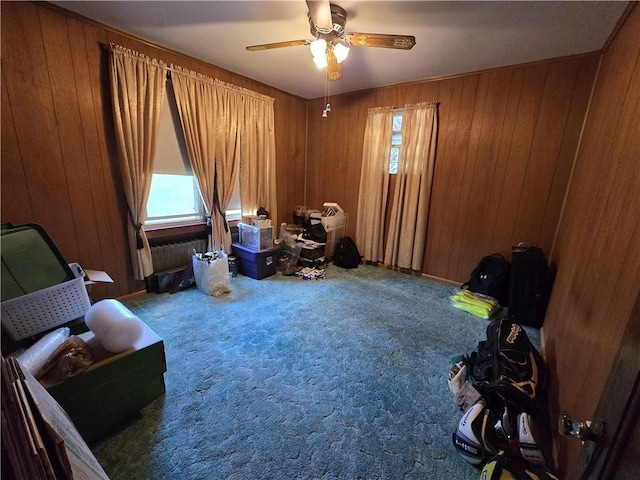 229 Bluff St, Canonsburg, PA 15317 - living area featuring carpet, wooden walls, and a ceiling fan