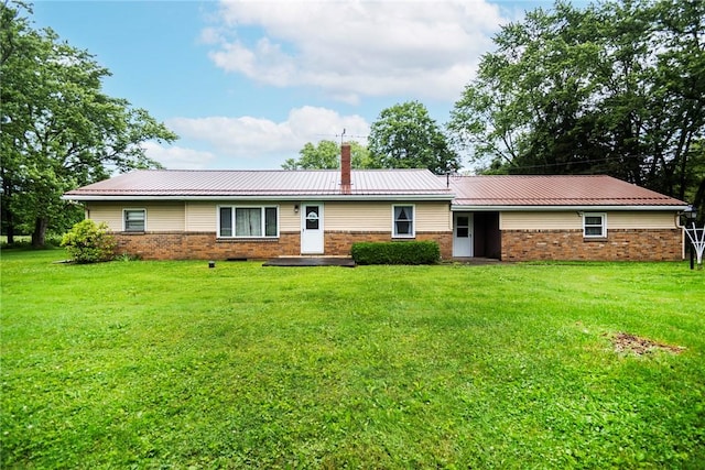 2712 State Route 351, Little Beaver Twp, PA 16120 - view of front of house with brick siding, a chimney, a front yard, and metal roof
