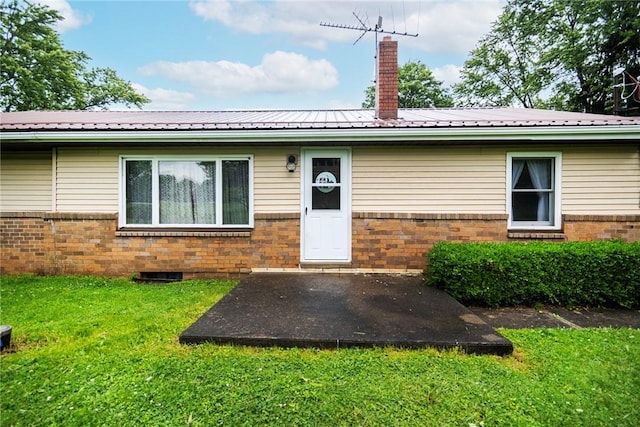 2712 State Route 351, Little Beaver Twp, PA 16120 - back of property with brick siding, a chimney, a yard, and metal roof